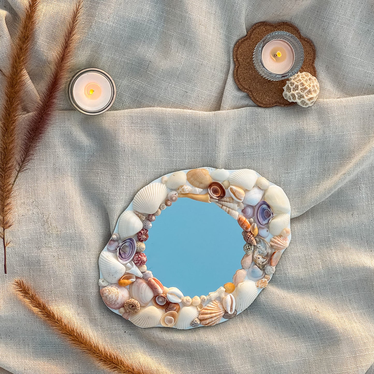 GRACE Seashell Mirror featuring handpicked seashells including scallops, conches, and cockles, set on a premium glass mirror. Measuring 24cm x 18cm, the mirror showcases a unique coastal design perfect for beach-inspired decor 4